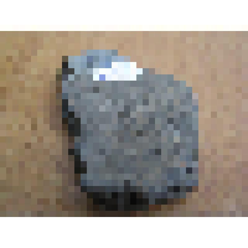 Обломок керамики темно-бурого цвета, прожженой, без орнамента