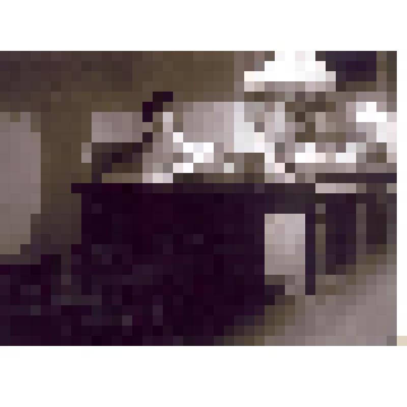 Фотография ч/б. Неизвестная девочка  сидит за столом, читает журнал. На столе настольная лампа, на подоконнике цветы в горшках.  Солотча (?). 1930-1940-е гг.  Автор -  К.Г. Паустовский