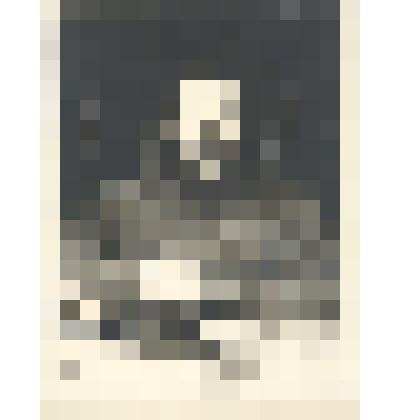 Фото Волошина М.А. за письменным столом с чернильницей