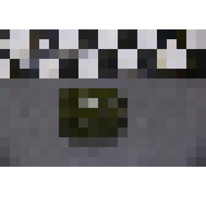 коллекция В.Ф. Лагодича. Талисман каменный лежачий, выполнен в виде головы человека. На выдающемся подбородке, вырезана борода. Камень зеленого цвета