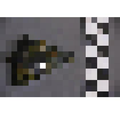 коллекция В.Ф. Лагодича. Талисман каменный лежачий, выполнен в виде головы человека. Подтреугольной формы. Сквозное отверстие образует глаза