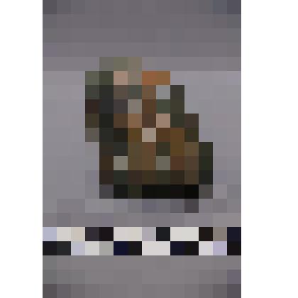 коллекция В.Ф. Лагодича. Талисман каменный, выполненный в виде головы человека. Камень серого цвета с прожилками светло коричневого