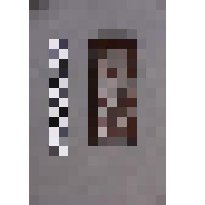 коллекция В.Ф. Лагодича. Деревянная пластина инкрустирована оловом. В рамке фигурка пляшущего человека в маске, от которой отходят лучи