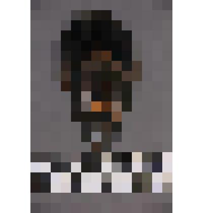 коллекция В.Ф. Лагодича. Талисман на металлической пластине в виде лица человека. В меховом головном уборе (сохранилась часть из черного меха)