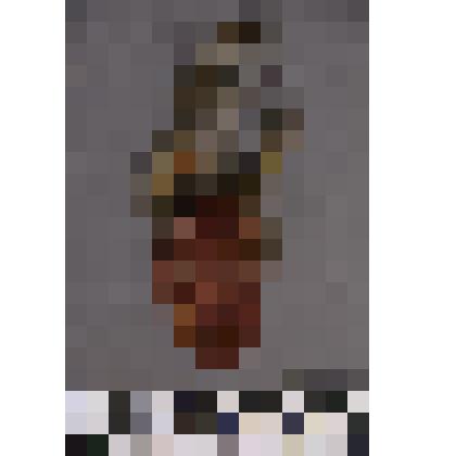 коллекция В.Ф. Лагодича. Талисман деревянный выполнен в виде головы человека. Вырезано схематичное лицо. Головной убор в виде перьев