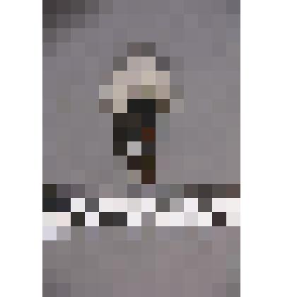 чеканка. Талисман на металлической пластине в виде лица человека. Волосы из меха. На обратной стороне подложка из кожи. Вверху пластины закреплено металлическое кольцо